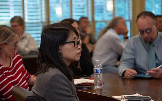 faculty members viewing presentation