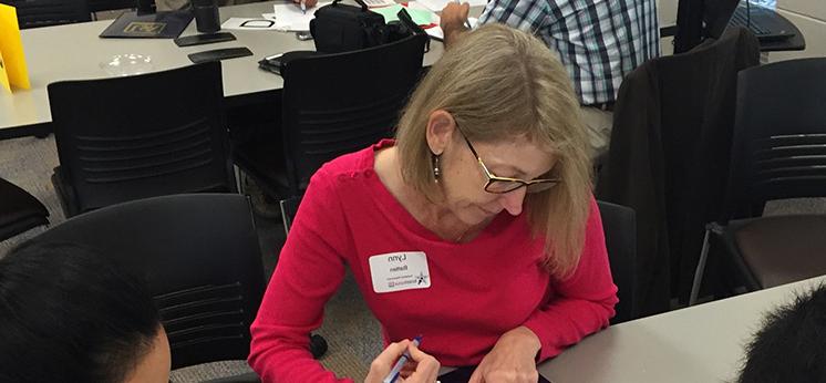 Woman writing in workshop